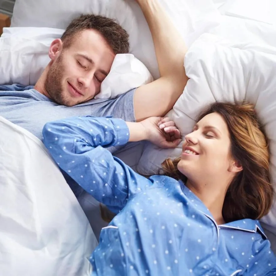 Couple sleeping quietly after using the SleepZee anti-snoring mouthpiece